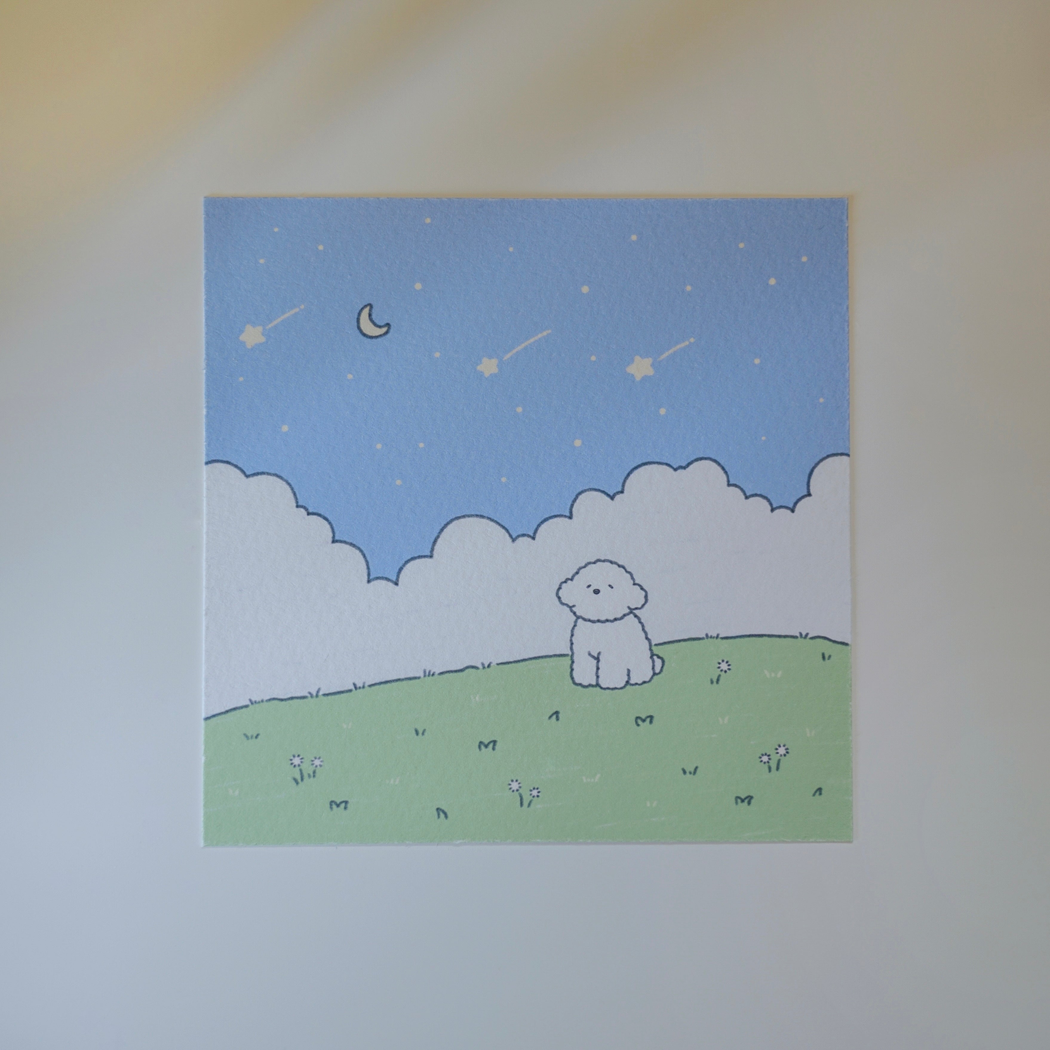 Illustration of a dog sitting on a grassy hill under a starry sky with a moon.