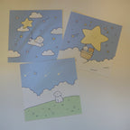 Three art prints with cute designs of a bear, dog, and stars on a light blue background.