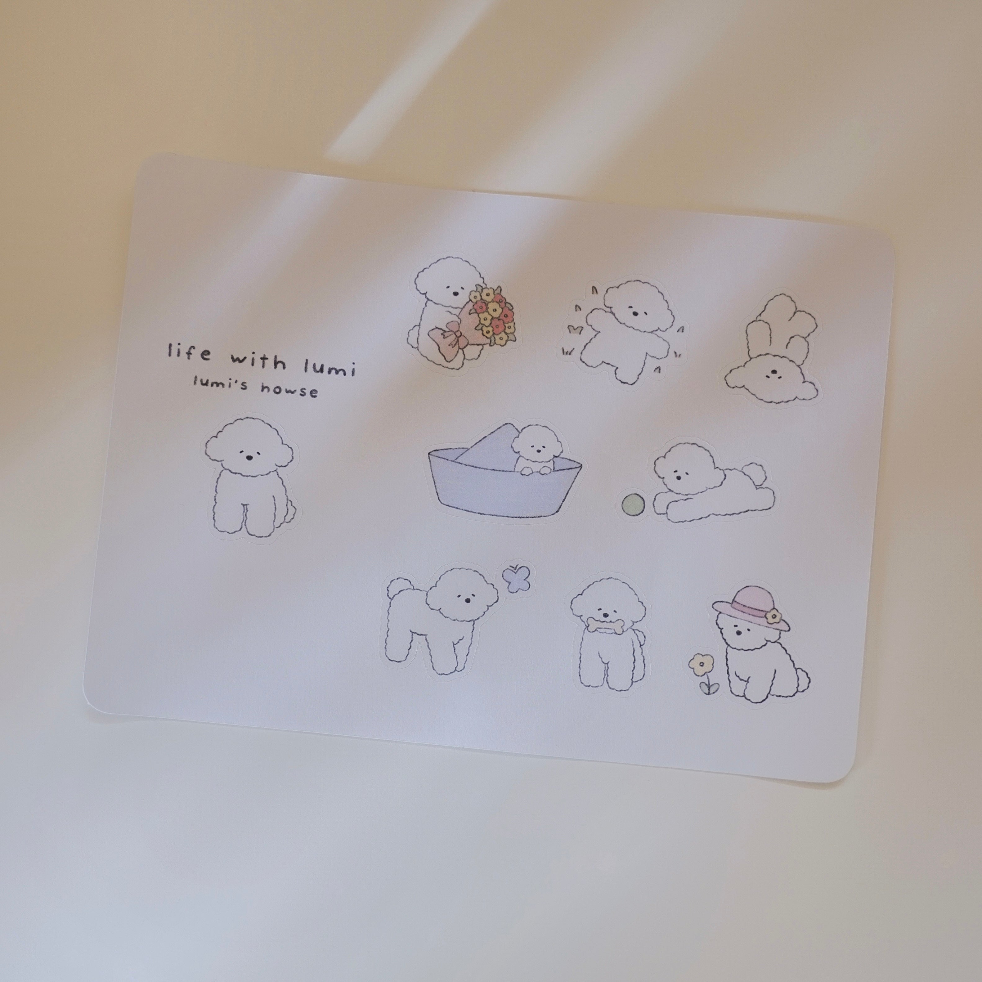 Sticker sheet of illustrations featuring a dog with various activities on a plain background.