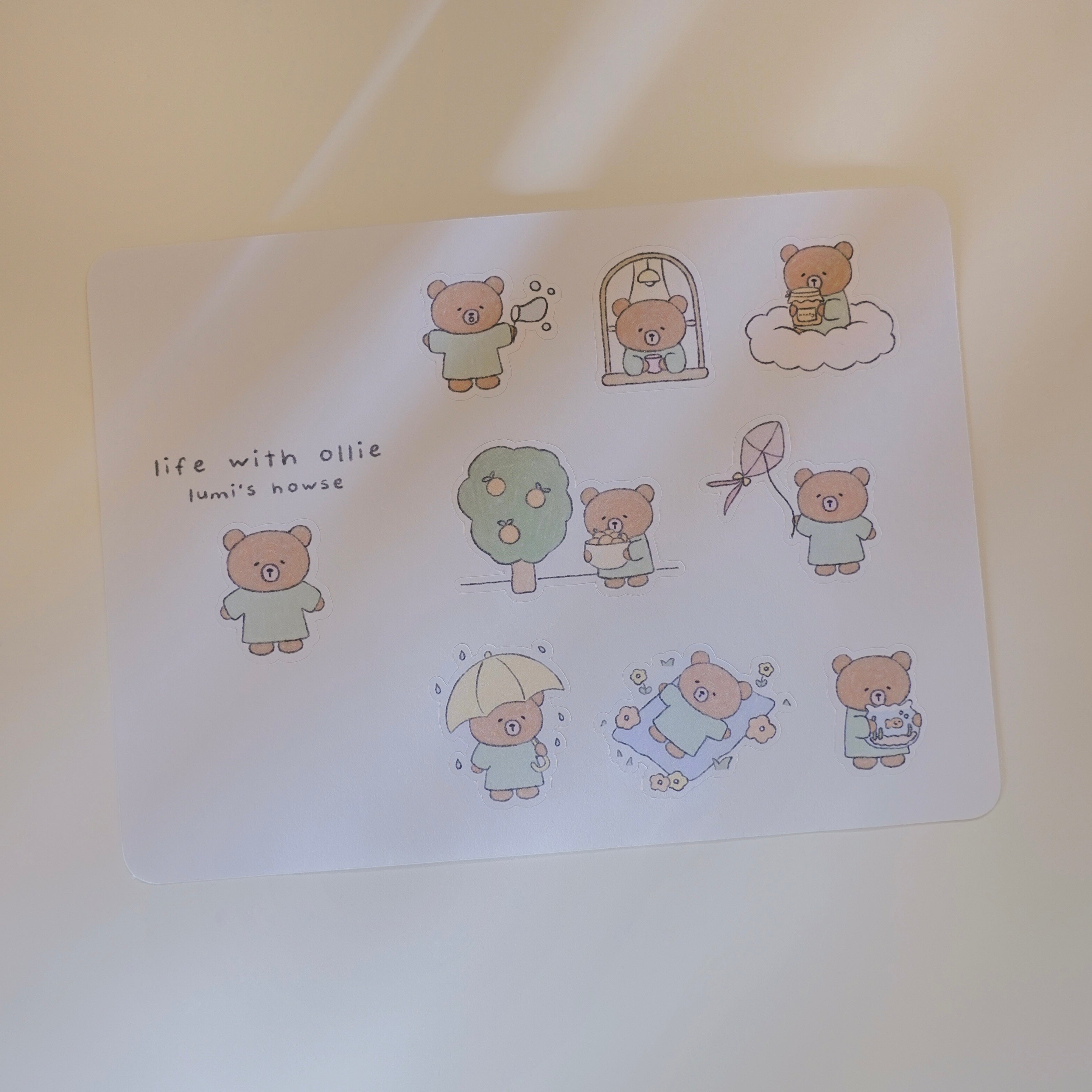 Sticker sheet with cartoon bears and text on a light background.