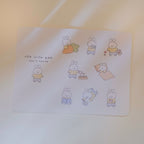 Sticker sheet with cartoon bunnies and text on a light background.