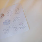 Sticker sheet of small dog illustrations on a white background.