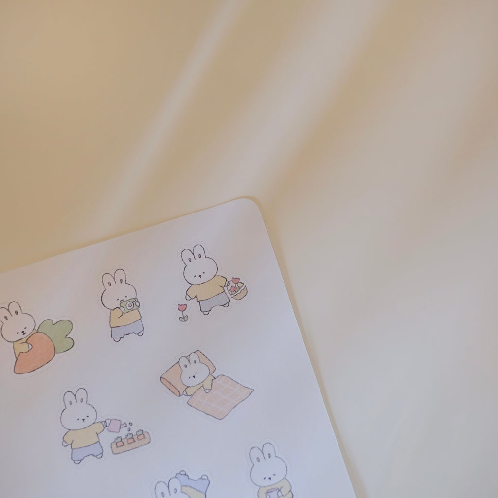 Sticker sheet of cute cartoon rabbit stickers on a light background.