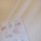 Sticker sheet of cute cartoon rabbit stickers on a light background.