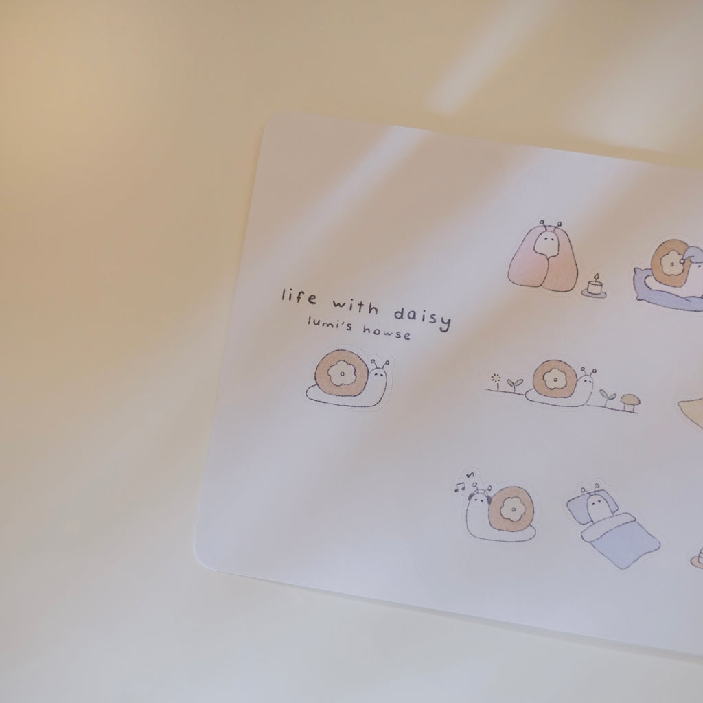 Sticker sheet with cartoon illustrations of a snail and text on a light background.