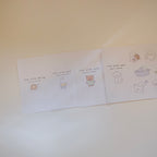 Four sticker sheets with cartoon animal characters on a white surface.