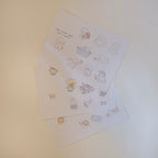 Set of illustrated sticker sheet with cute animal designs on a light background.